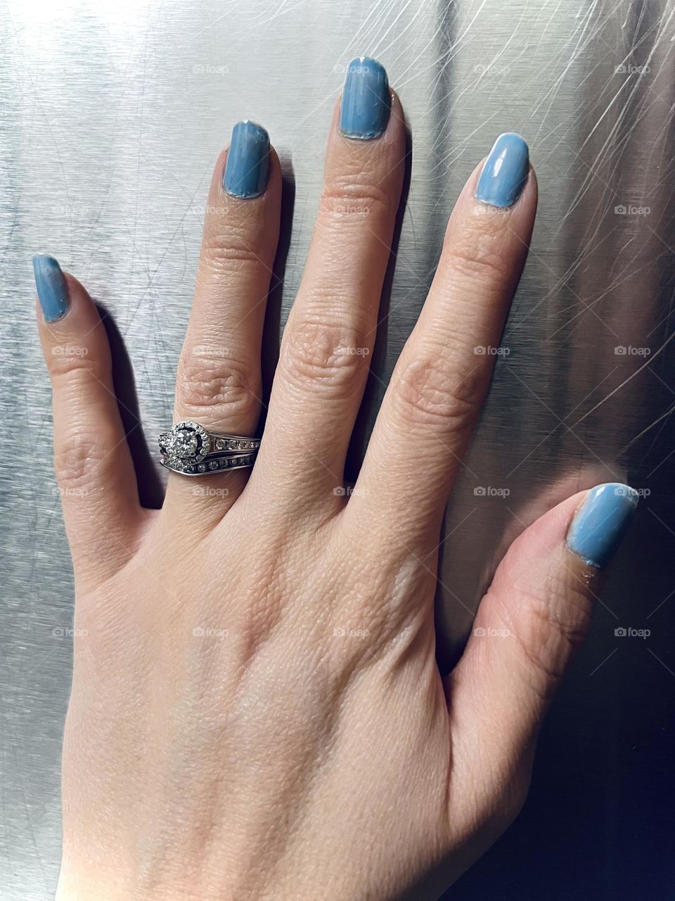 Soft blue gel nail manicure 