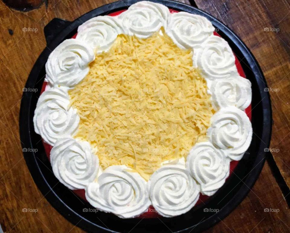 cheesecake garnished with white rose chantilly