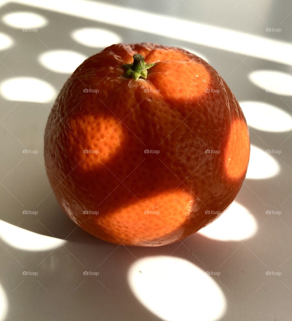 tangerine in the shade of the sun