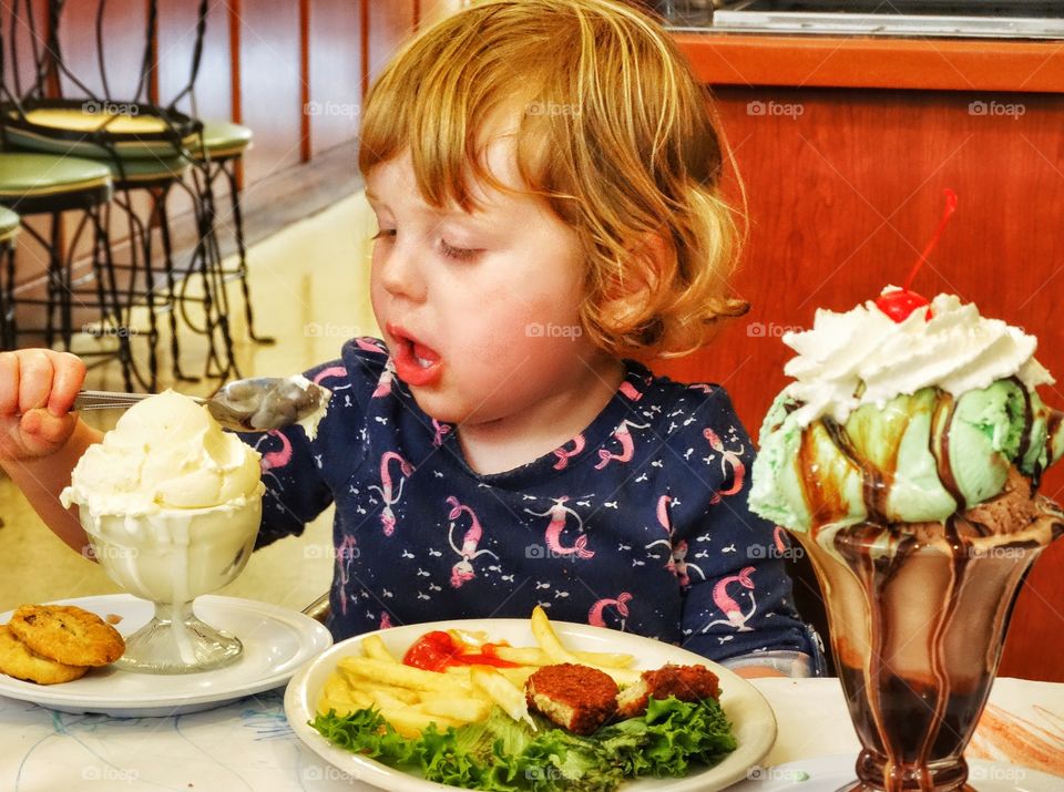 Young Girl Eating Junk Food