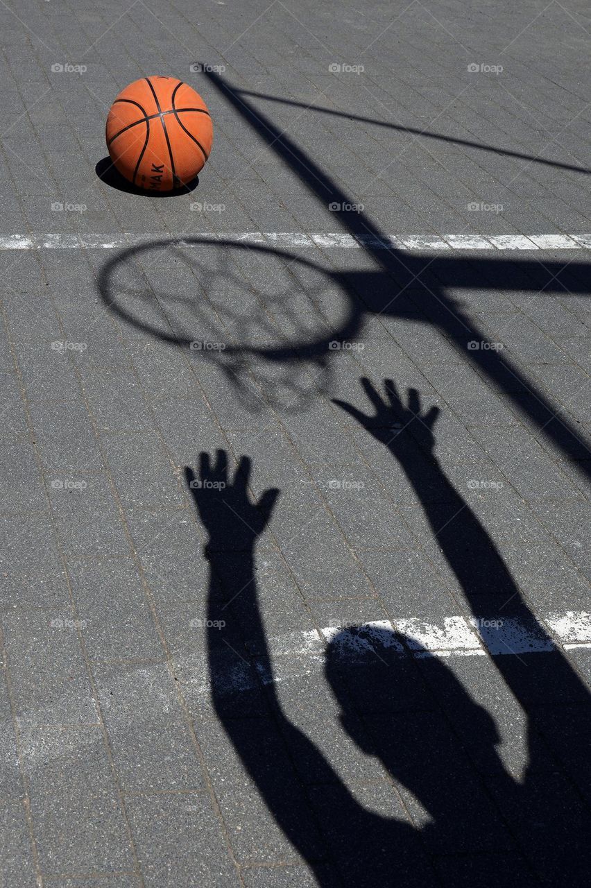 Basketball hoop and ball shadow