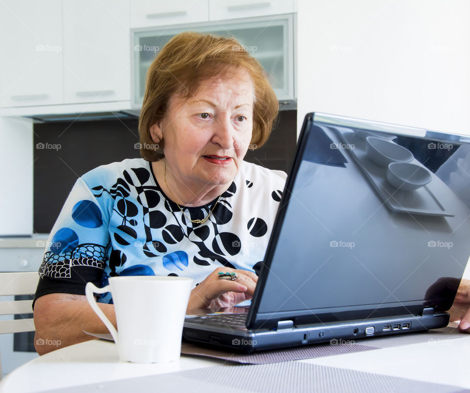 elder woman with laptop