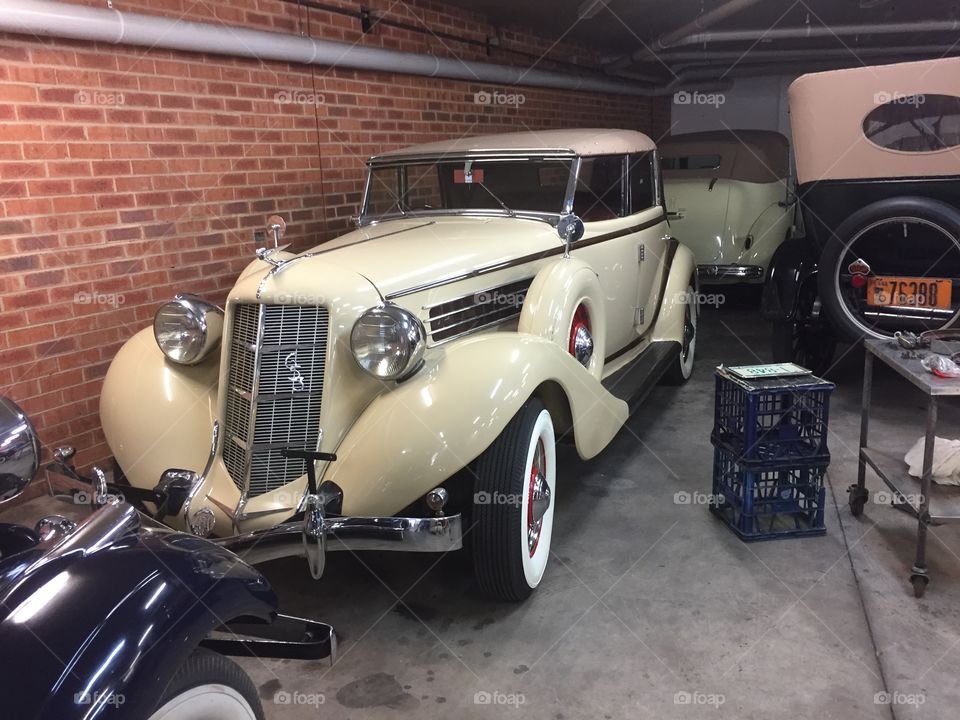 My grandfathers very old car in the garage