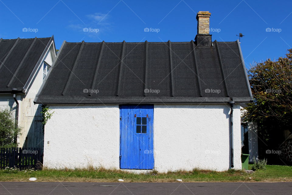 White house with blue door.