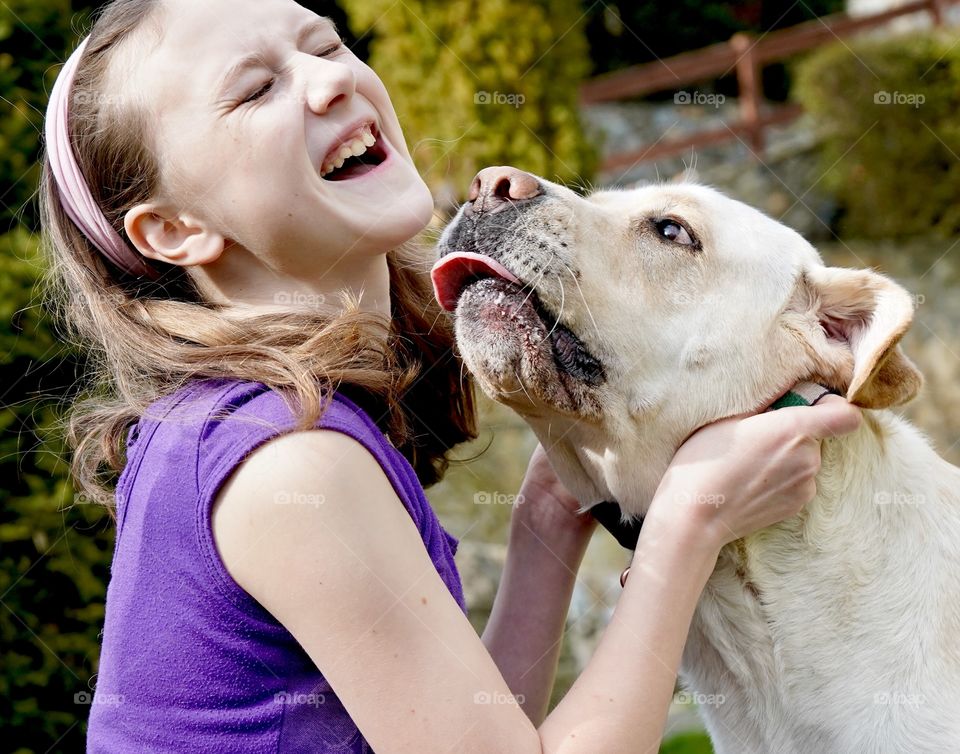 Big yellow lab tries to kiss his best human buddy