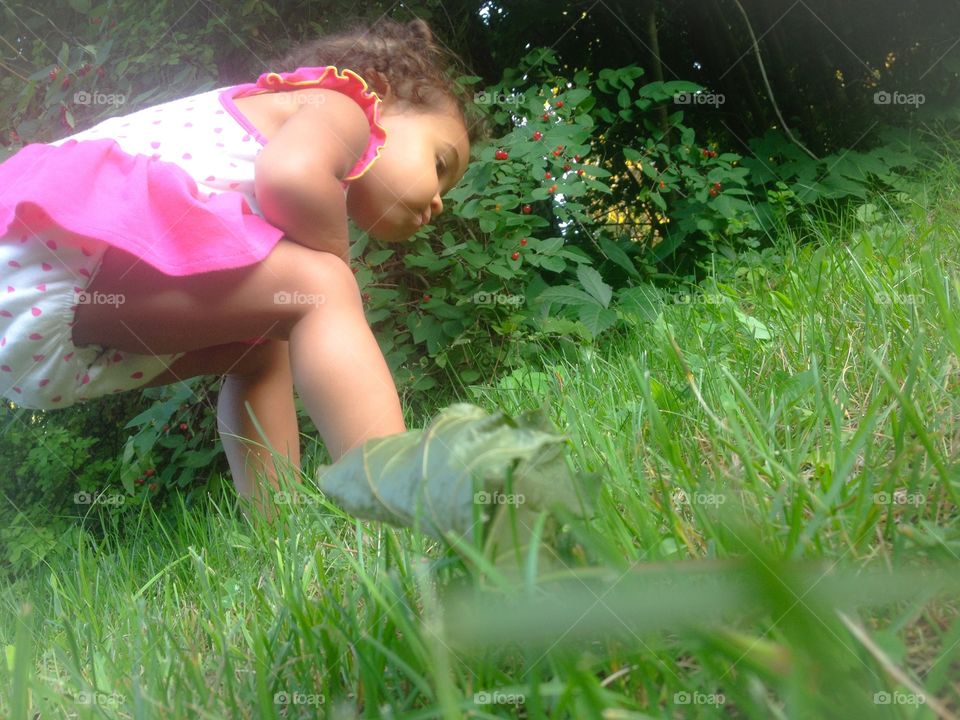 Simple things. A toddler checking out some bugs