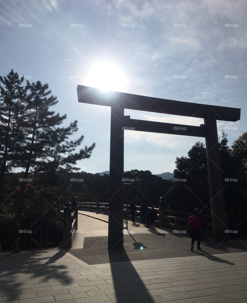 Torii ( Gate of Japanese Shinto Shrine) in Ise, Japan.  Morning Sun rays 