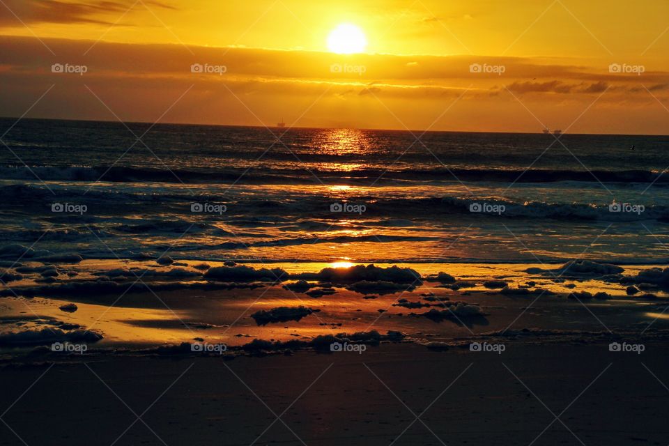 Sunset at sea with dramatic sky