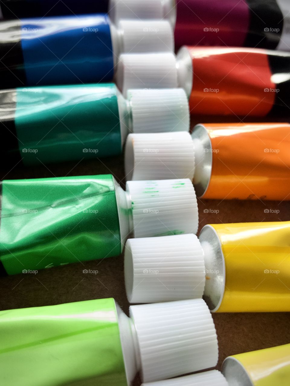 Closeup of tubes of oil paints in rich colors