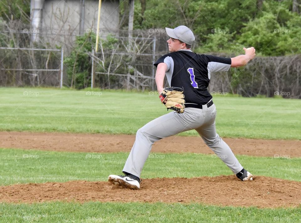 High school baseball game, pitcher on the mound 