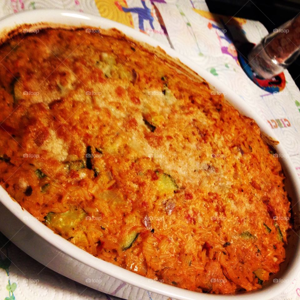 Baked rice. Baked rice with vegetables cooked in the oven ready to eat