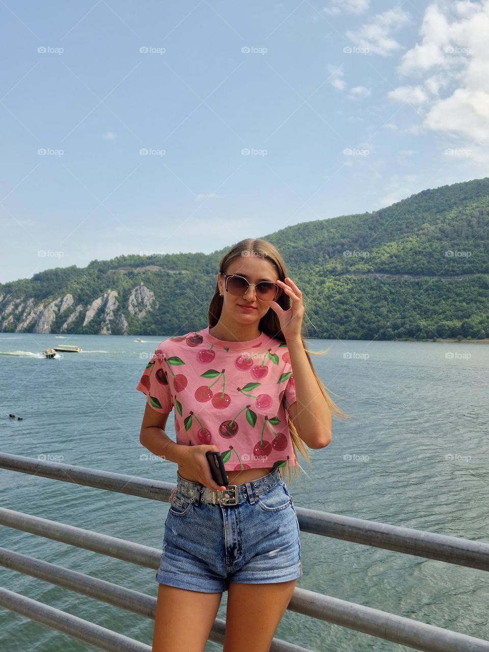 the young girl with the magenta t-shirt with cherries