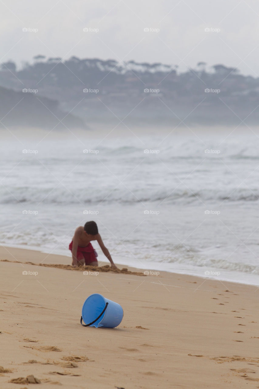 beach child sand waves by splicanka