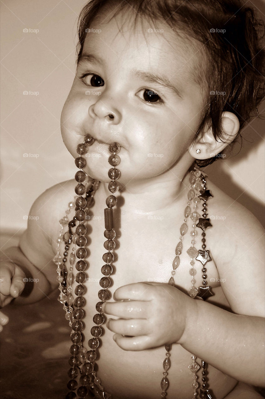 Bath-Time!!  Had to have her beads in her mouth the whole time!