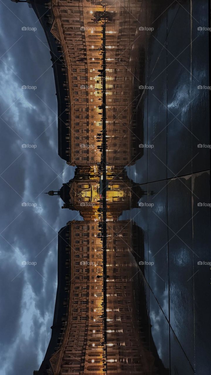 Reflection of beautiful building in the water at night 