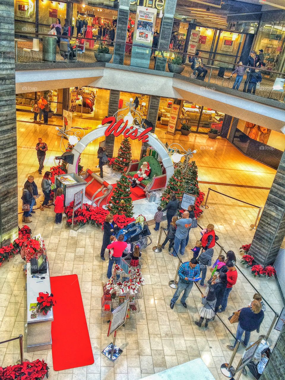 Shopping mall interior decorated with christmas trees