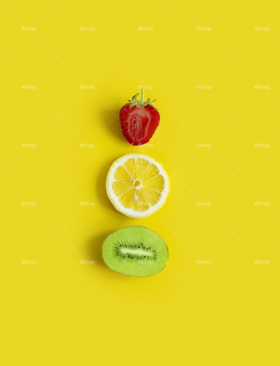 Summer fruits on yellow 