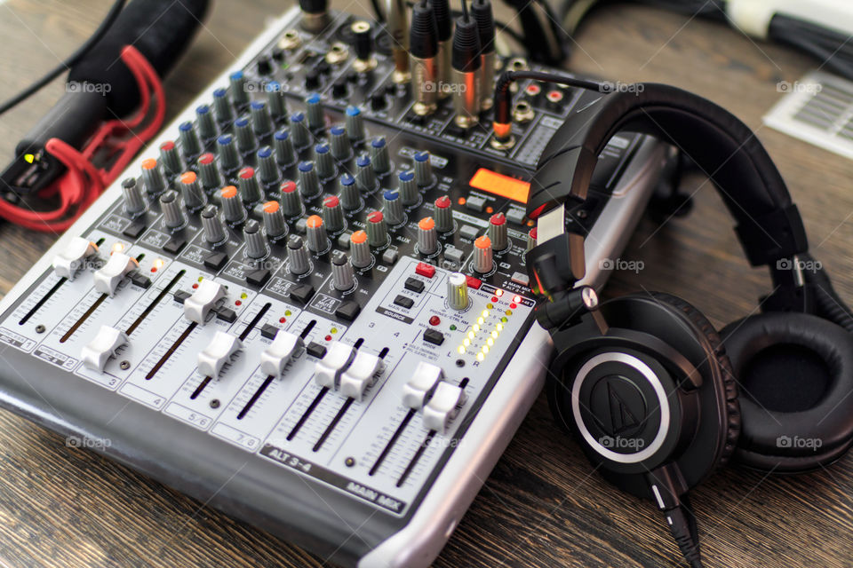 mixing console, headphones and microphone