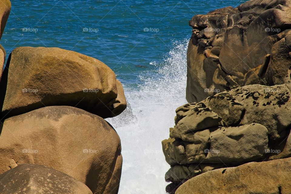 waves crashing on rocks