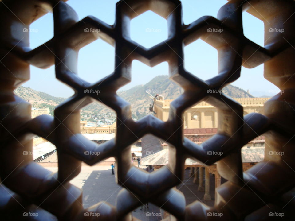 View of mountains in India through gate.