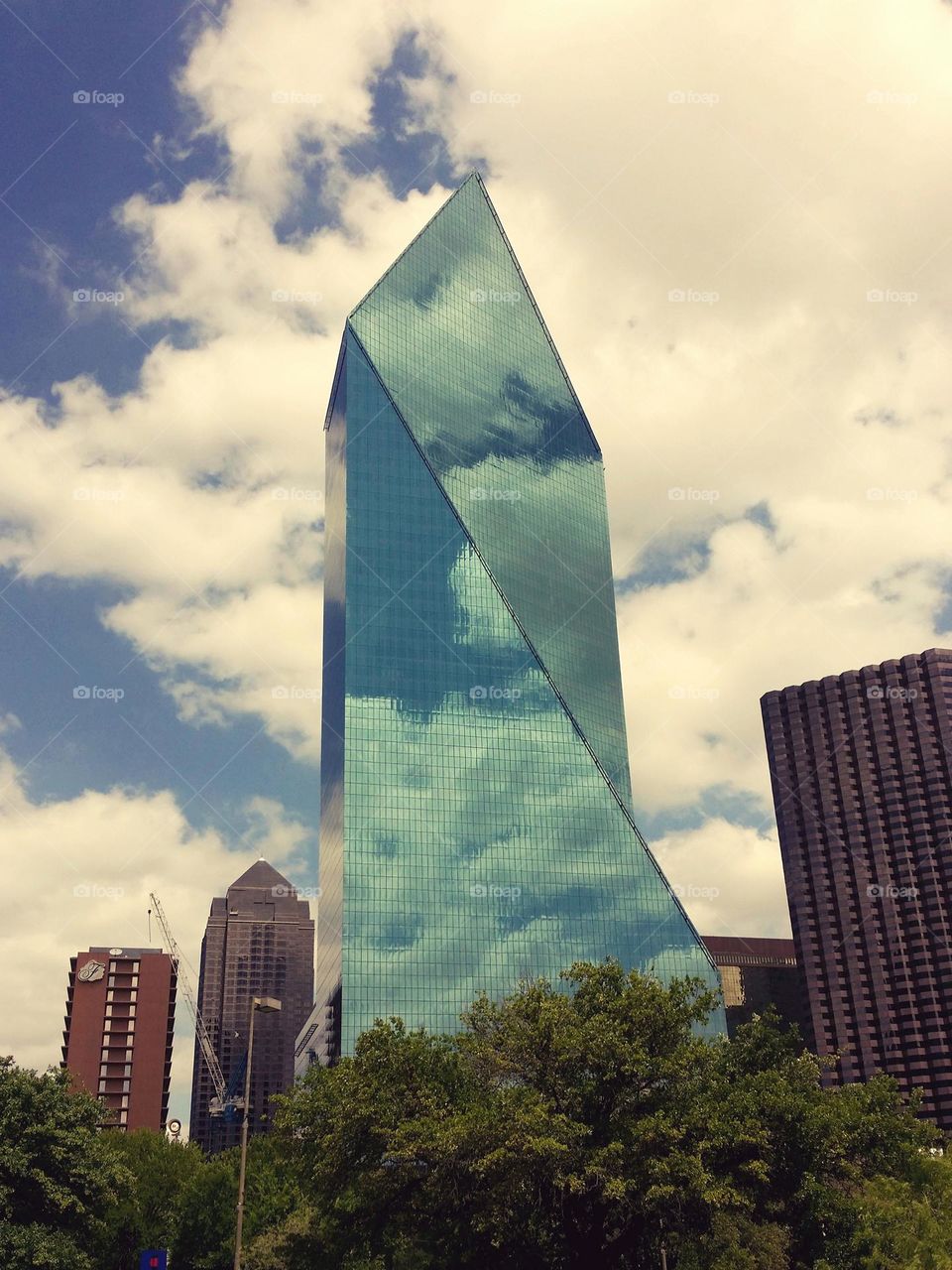 Clouds reflecting on a glass skyscraper in Dallas Texas