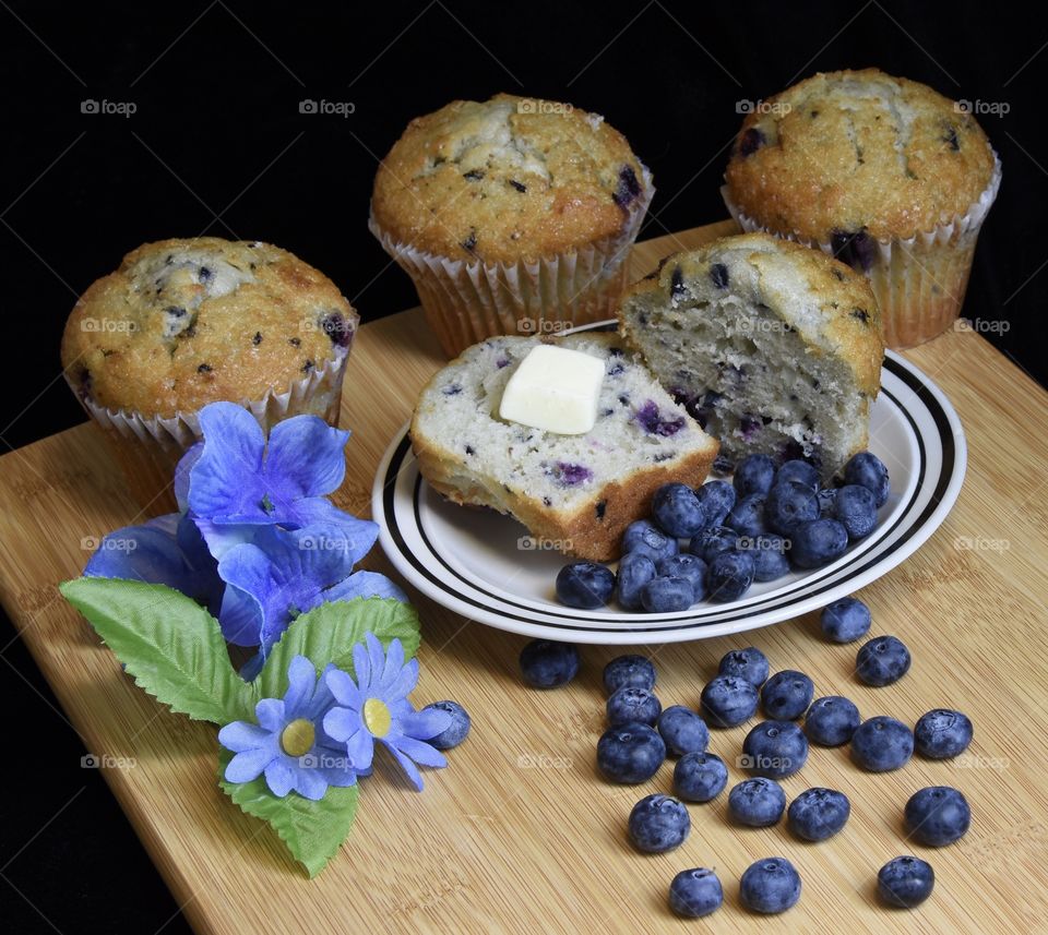 Blueberry muffins and fresh blueberries still life 