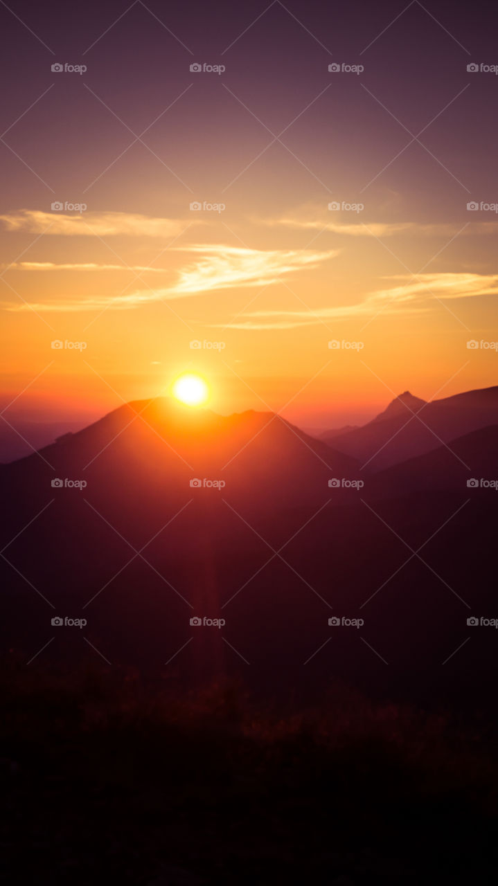 An inspiring purple mountain landscape. Tatry mountains in Slovakia. A beautiful wallpaper for smartphone screen. Purple abstract gradient with perspective.