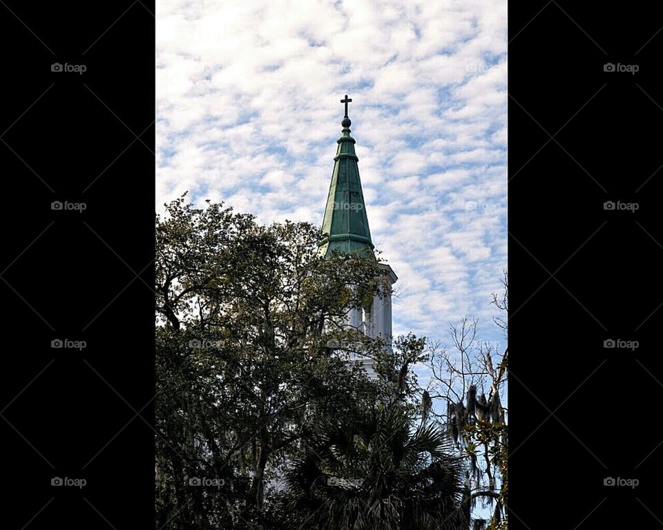Church steeple in the clouds
