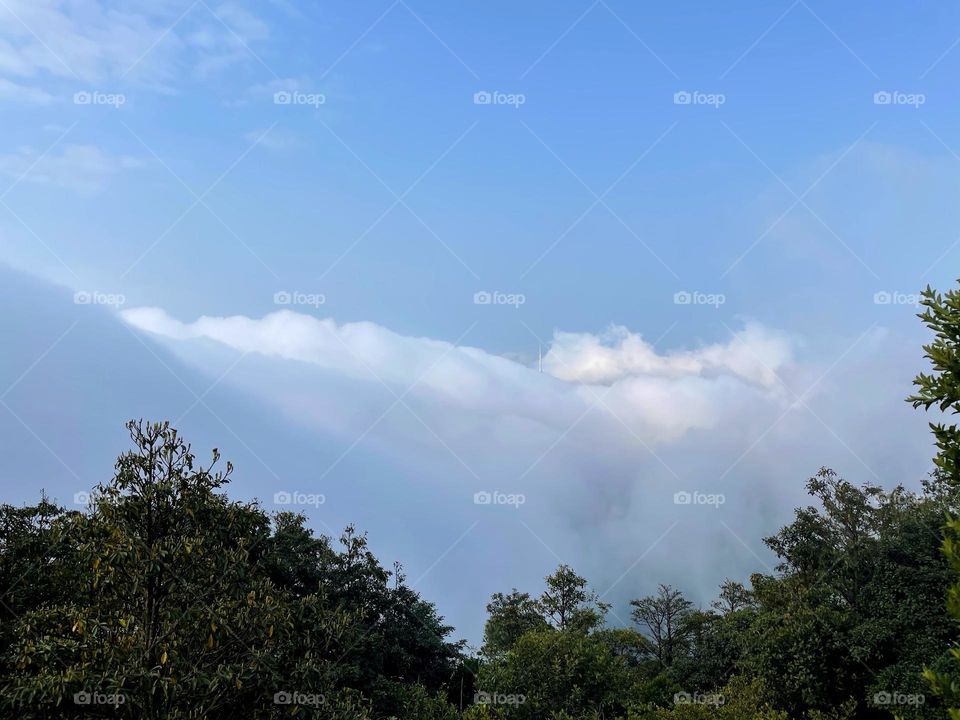 surrounded by clouds