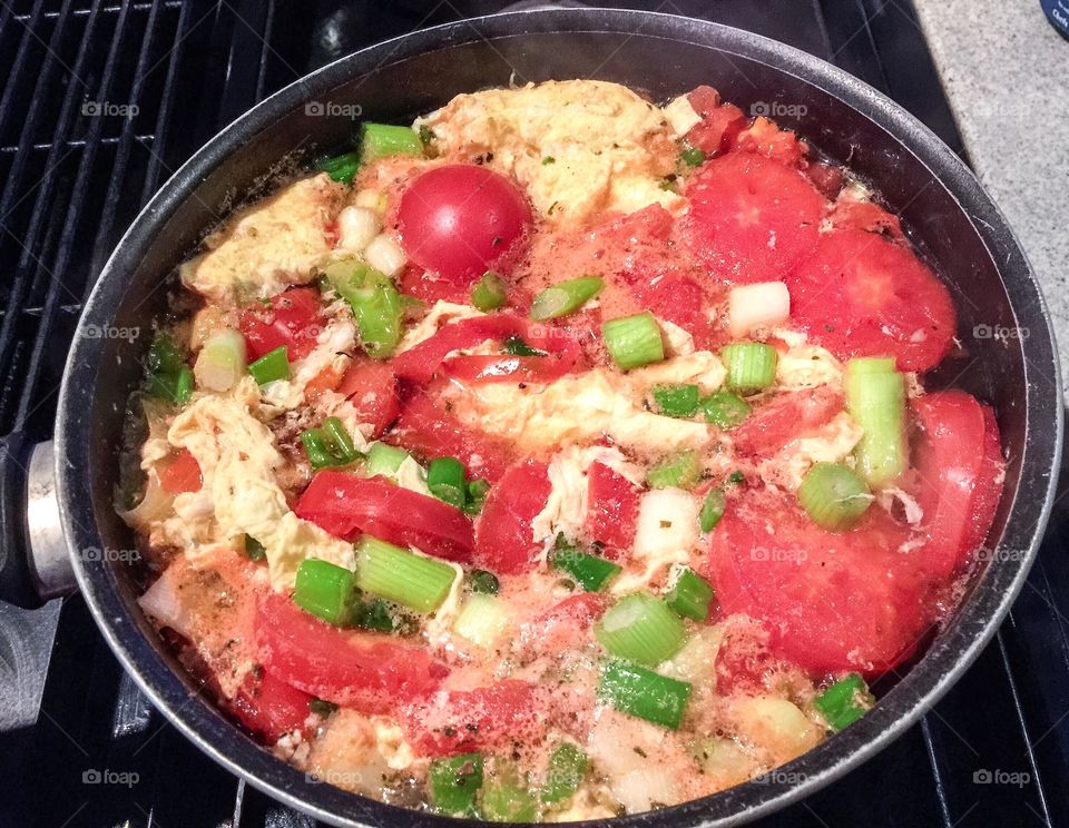 Homemade tomato, egg, garlic, and green onion soup, with seasonings. Very simple to make. Could eat over and over. 