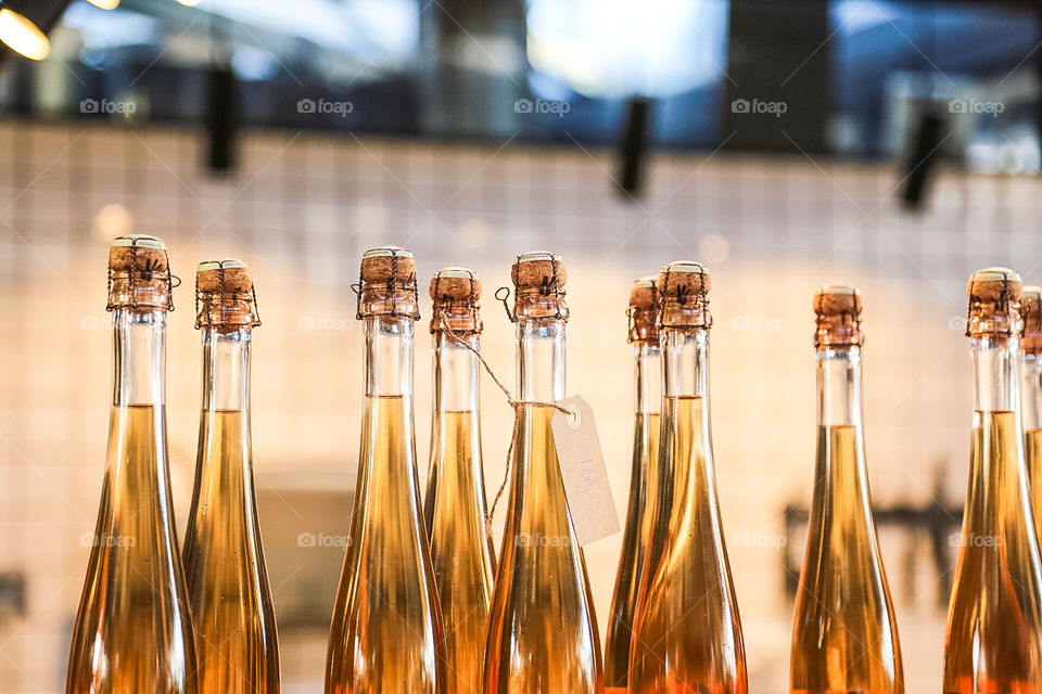 Glass bottles with corks on display 