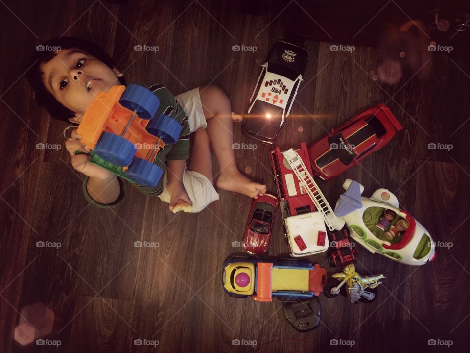 Kid playing with toys . Toys 