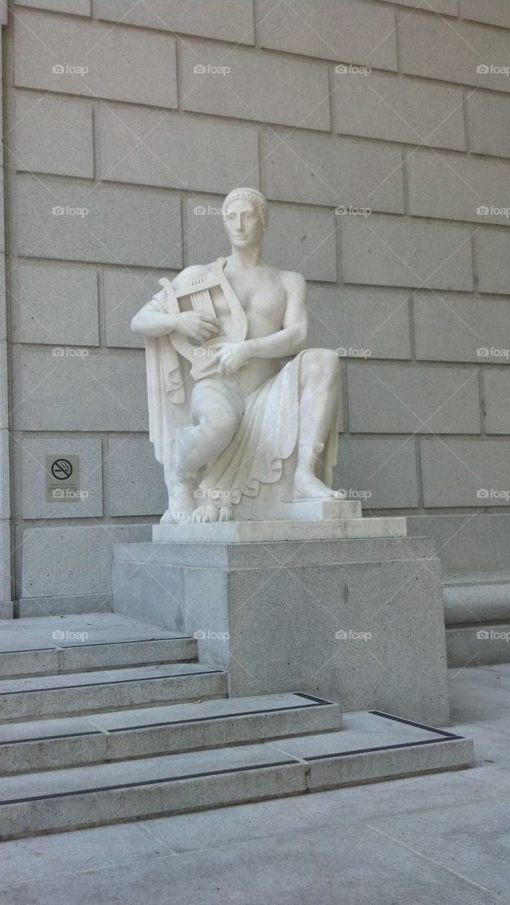 statue with lyre