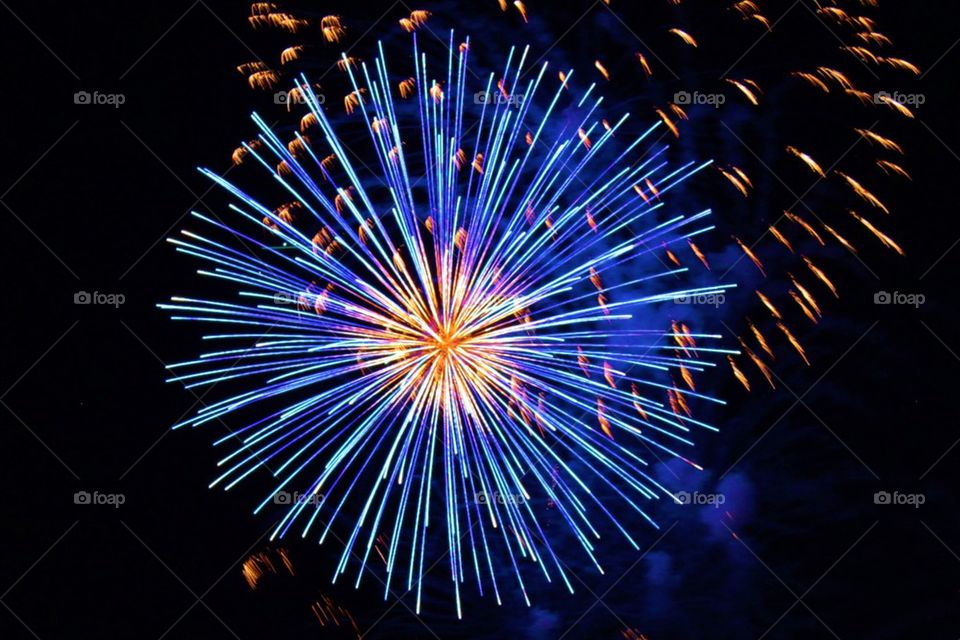 Illuminated firework display against  sky at night