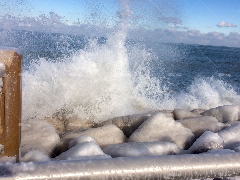 Water splashing on icy rocks 