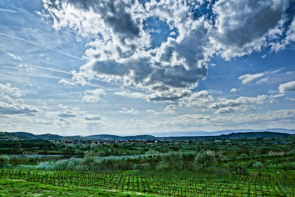 Clouds cape over the green fild