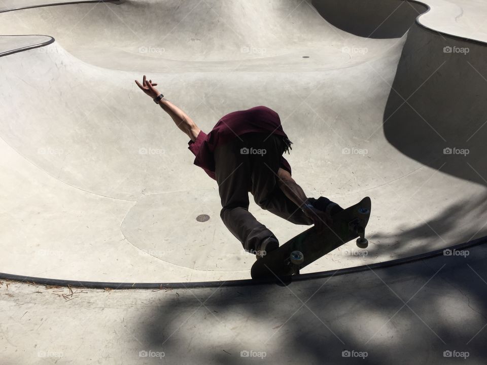 Skateboarder practicing at the skate park