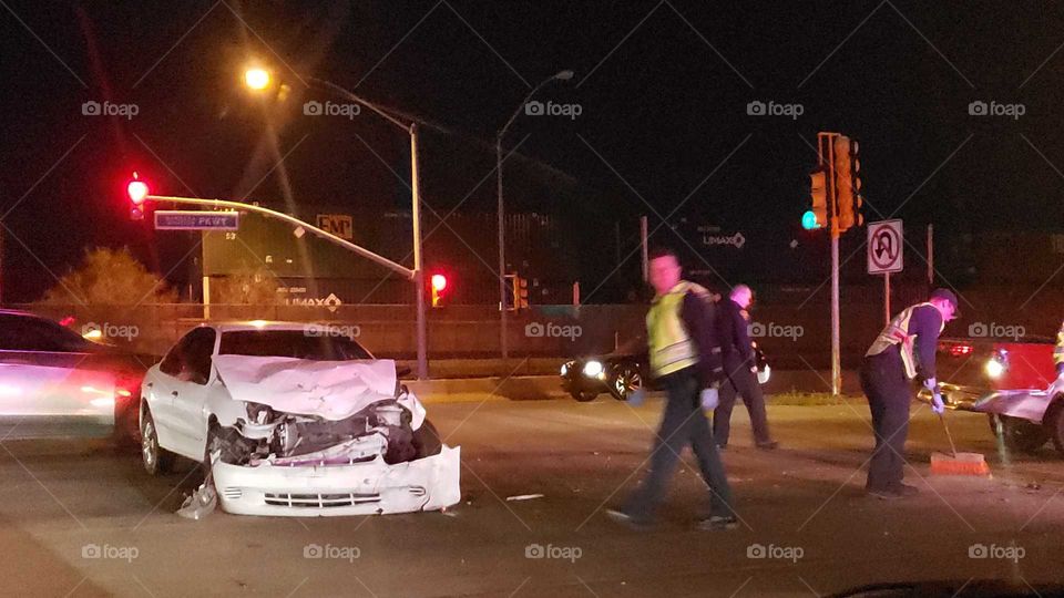 cleaning up an automobile accident fireman