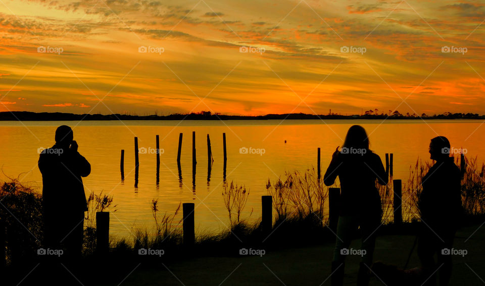 Amazing Silhouettes! Like the meeting of two worlds - the known and the unknown. The sun is like a great big romantic, inspirational fire in the sky. Brilliant streaks of yellow, orange, gold, blue, pink and red overcome the blue and purple of the sky. The sky resembled a prism; all the colors blended perfectly together. It's as if the colors and intensity of the light is just right! My work is done for today. I'm not sure what tomorrow will bring, but I'll be prepared for it!