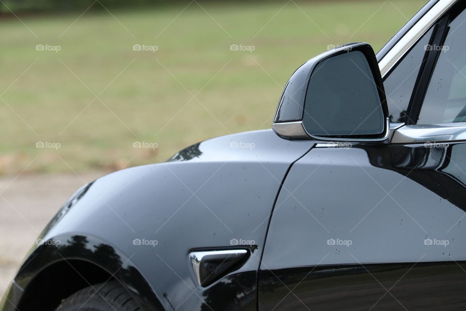 Details of the sleek black electric vehicle.