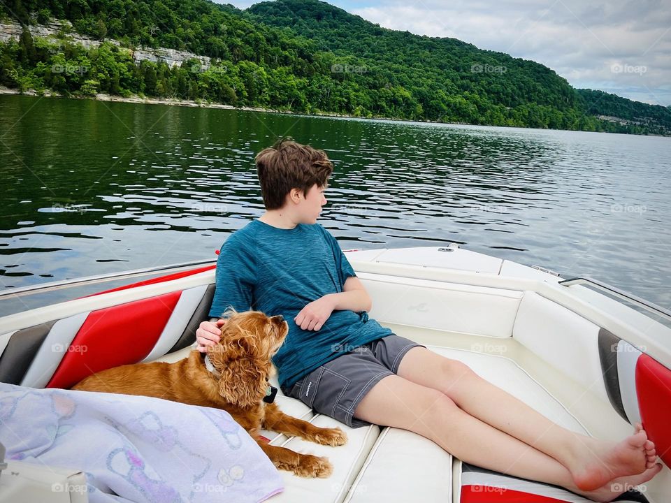 Enjoying the last days of summer out on the boat with his dog