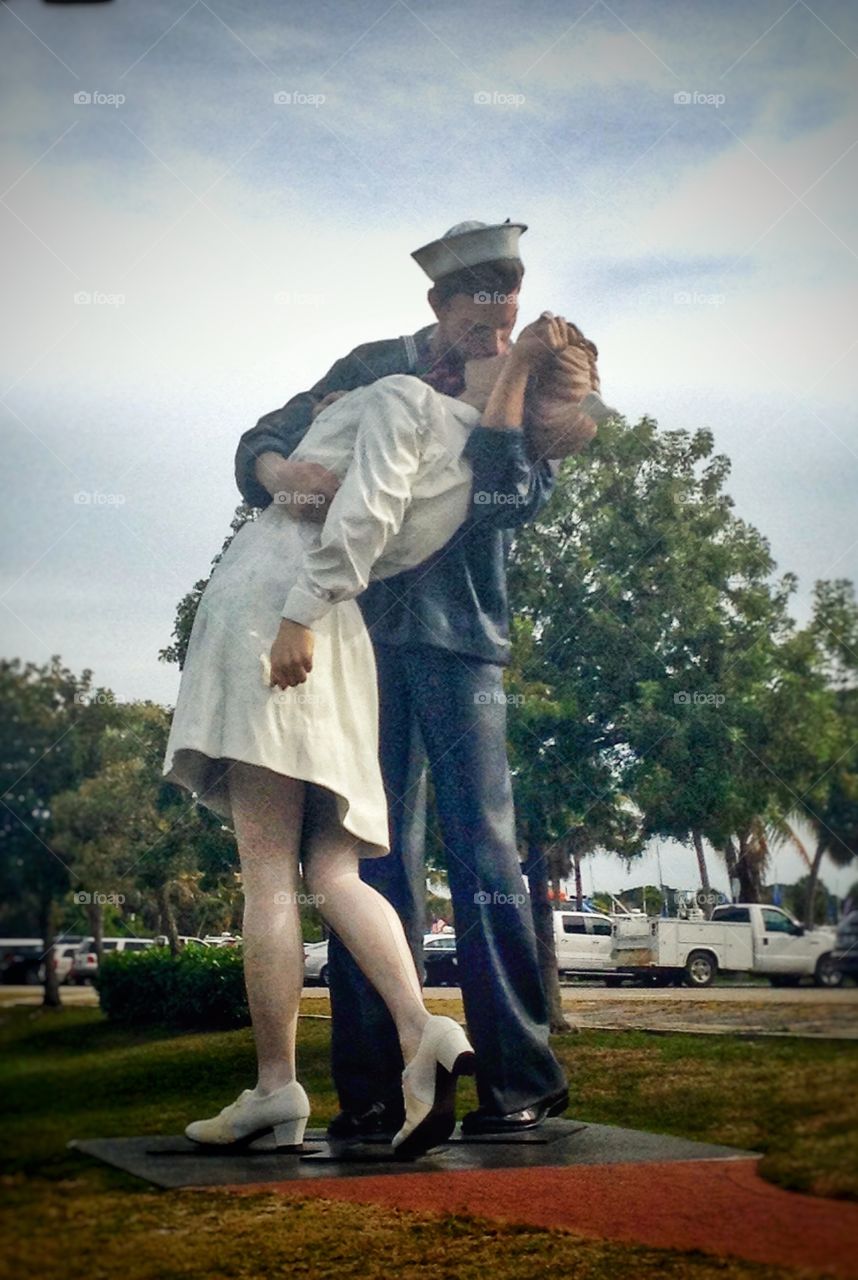 A very tall statue of the unconditional surrender....