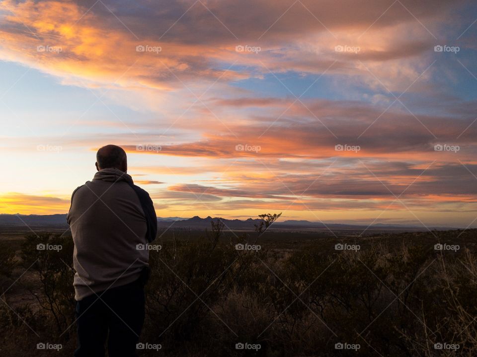 Silhouette of person against the evening sky