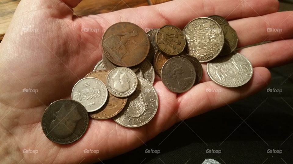 hand full of foreign coins