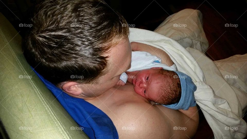 father holding newborn for first time