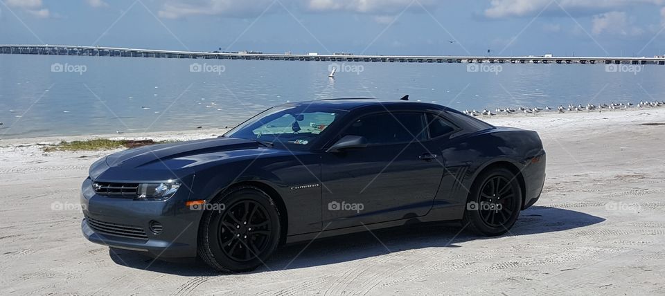 Blacked out Camaro on the beach in Tampa