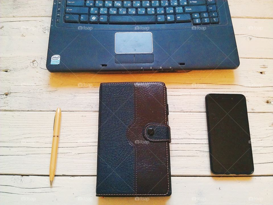 notebook, pen, organizer, a cup of tea on the desktop