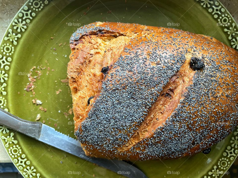 Close-up of a cake with anise on a green plate