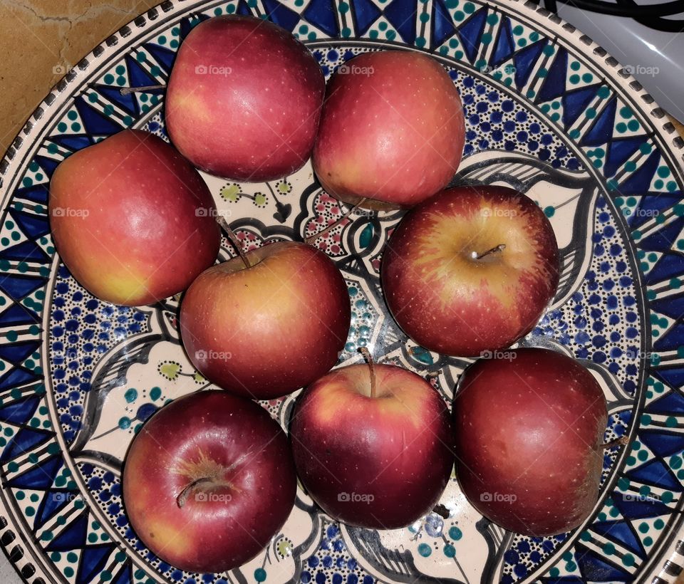 eight red apples on the table