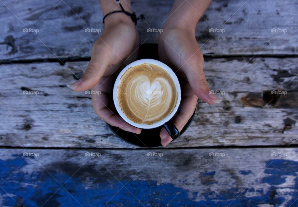 Person holding coffee